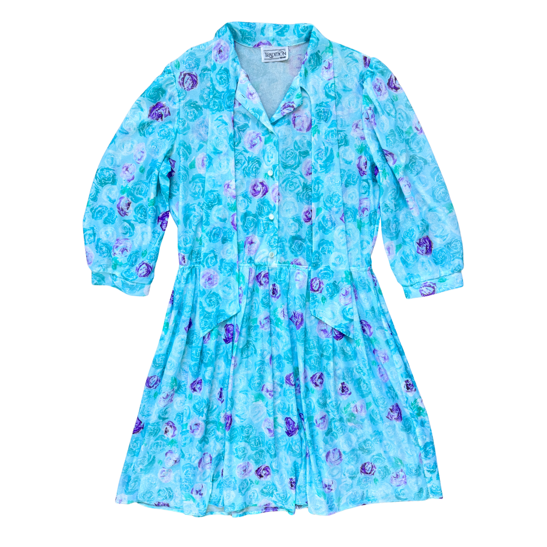 Vintage 1970s Tradition Sheer Blue and Purple Floral Print Dress with Faux Tie Collar | Medium