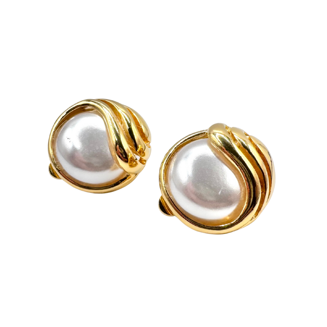 Signed EVCO faux pearl cabochon clip-on earrings in a wavy gold tone setting (Circa 1980s).