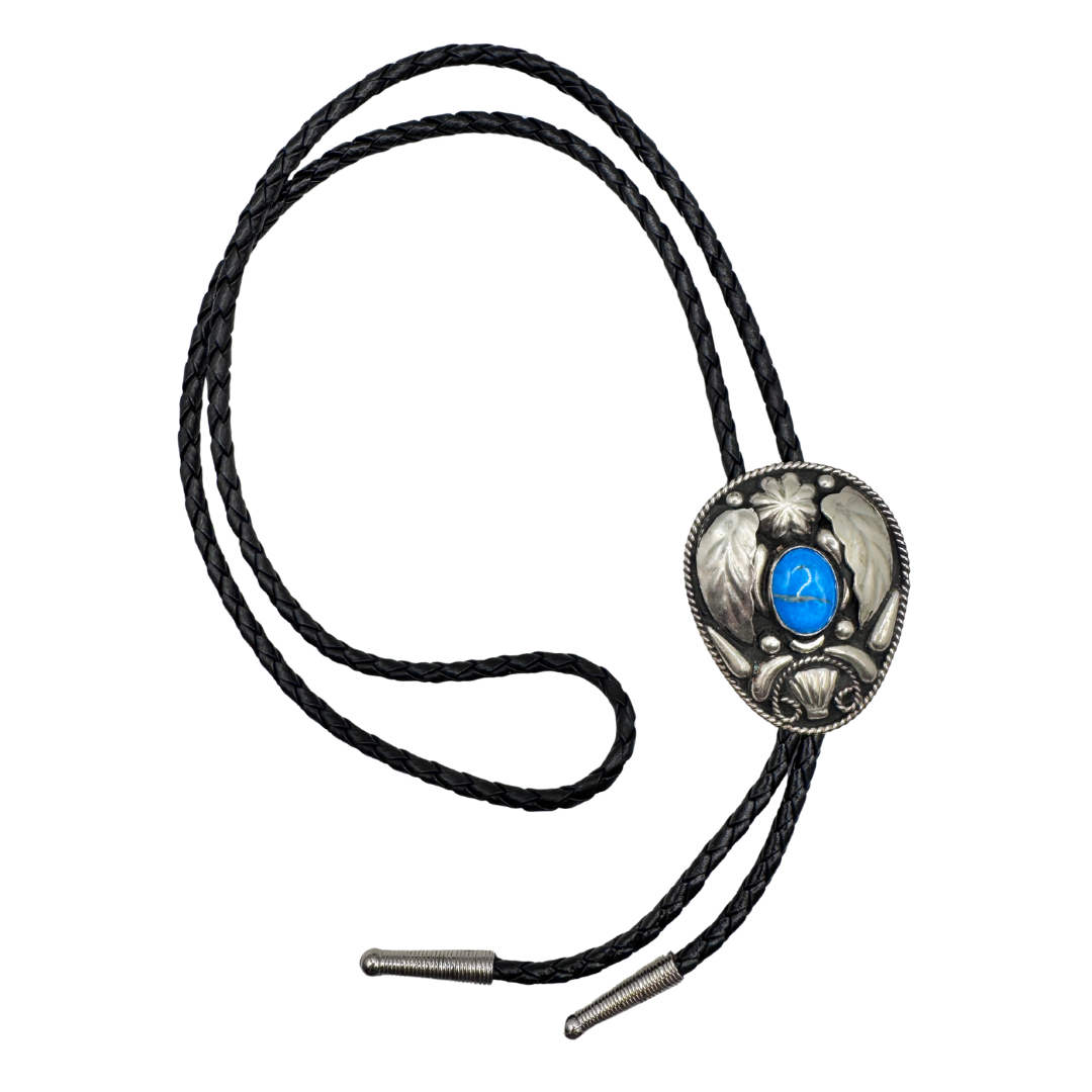 Double S alpaca silver bolo with inset turquoise stone and etched leaves, black braided leather cord