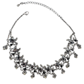 Vintage floral statement necklace with faux hematite, black and clear gemstones set in sterling silver plated base metal.