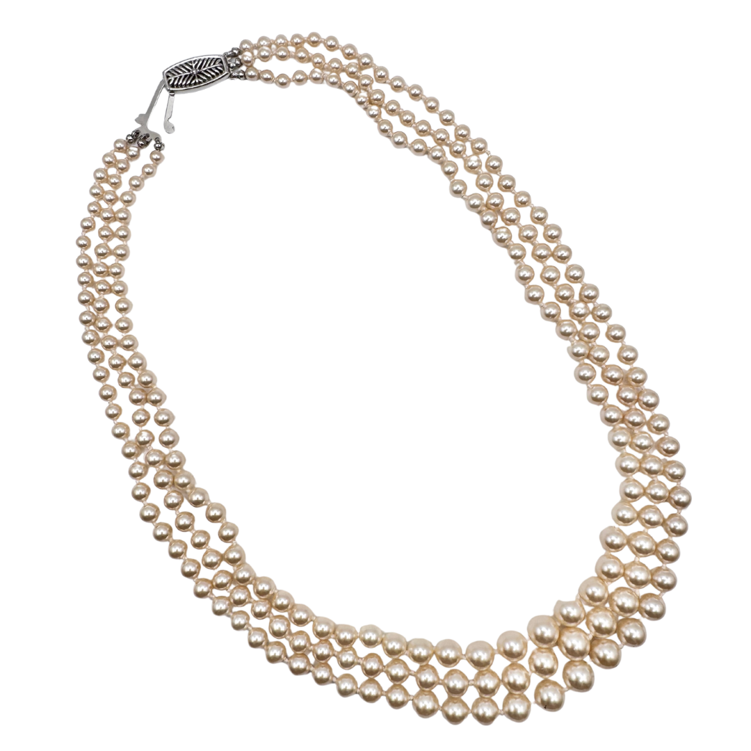 Vintage original signed EVCO three-strand glass pearl necklace.