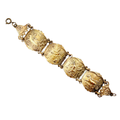 Vintage silver-plated brass Don Quixote story panel souvenir bracelet circa 1940s to 1950s. Each panel is engraved with story scenes from the famous classic novel by Miguel de Cervantes. Made in Spain. 
