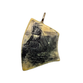 Genuine hand carved scrimshaw ox bone sailboat pendant. 