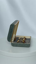 Load and play video in Gallery viewer, Vintage Krementz Gold Tone Oval Cuff Links with Ruby | 1950s
